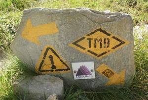 Direction marker stone on the Tour du Mont Blanc