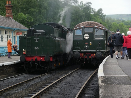 Two steam trains pass at Grosmont railway station