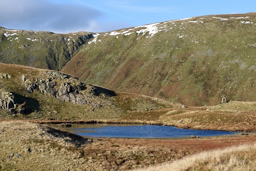 Greenup Edge behind the tarn from Calf Crag