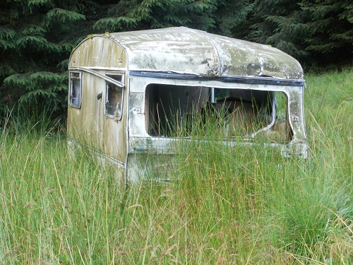 an old caravan in the forest