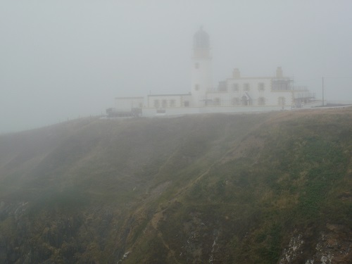Killantringan Lighthouse, barely visible in the sea mist