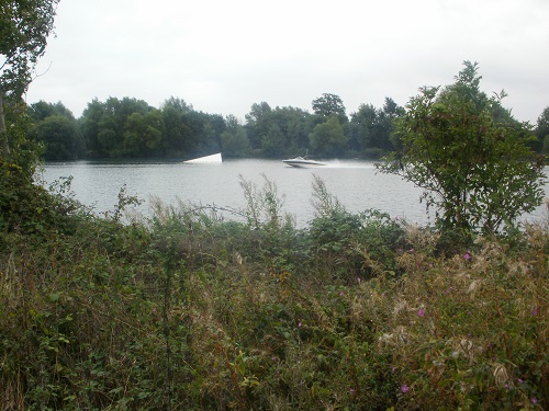 A speedboat speeds across Manorbrook Lake