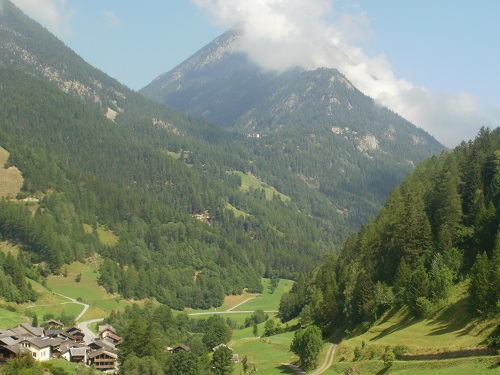 The TMB descends into Issert then up into the forest above it