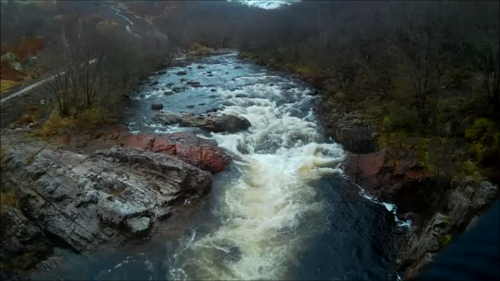 Fast flowing water under a bridge near Kinlochleven